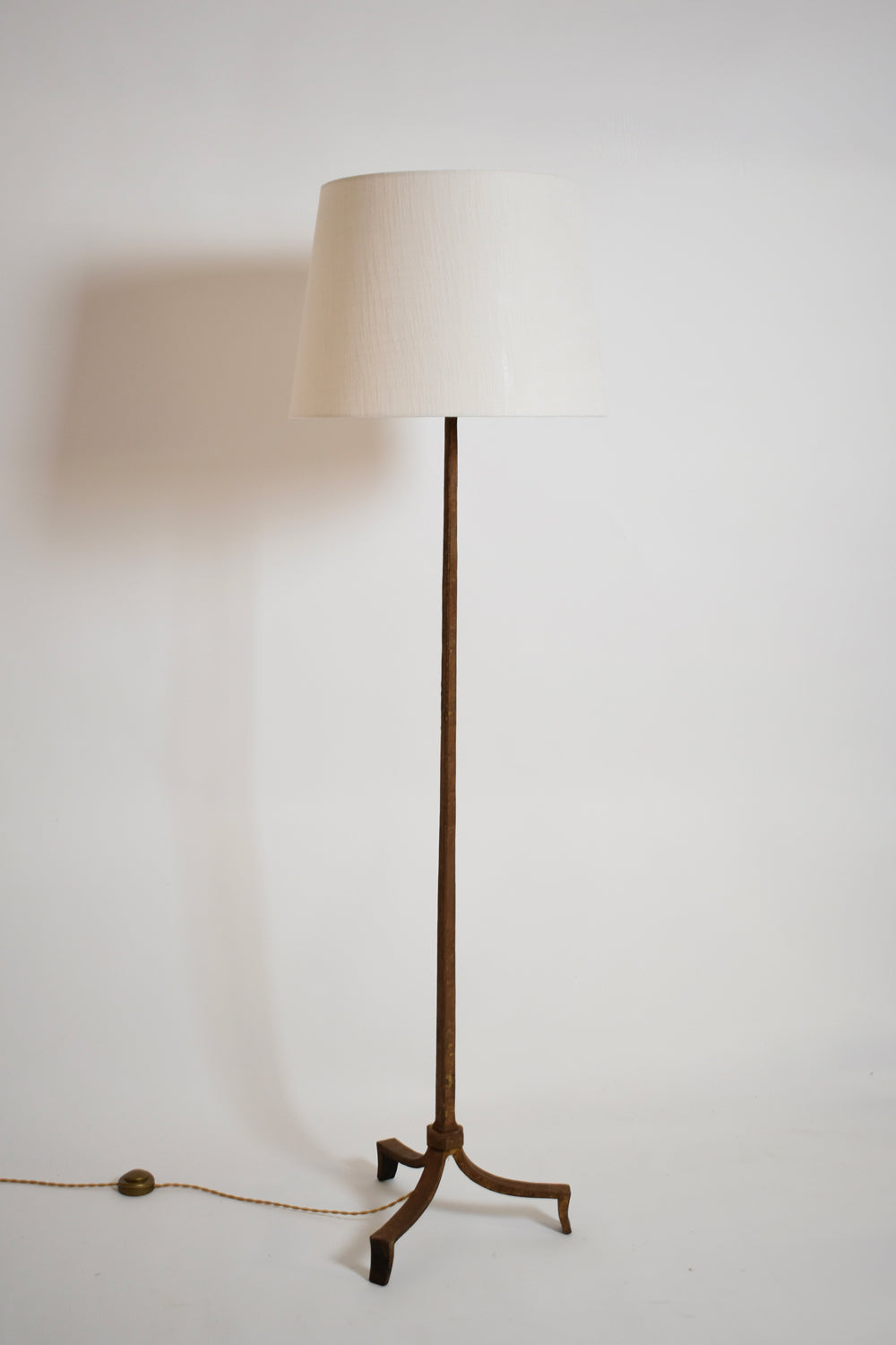 Ramsay tripod wrought iron floor lamp, 1960s.