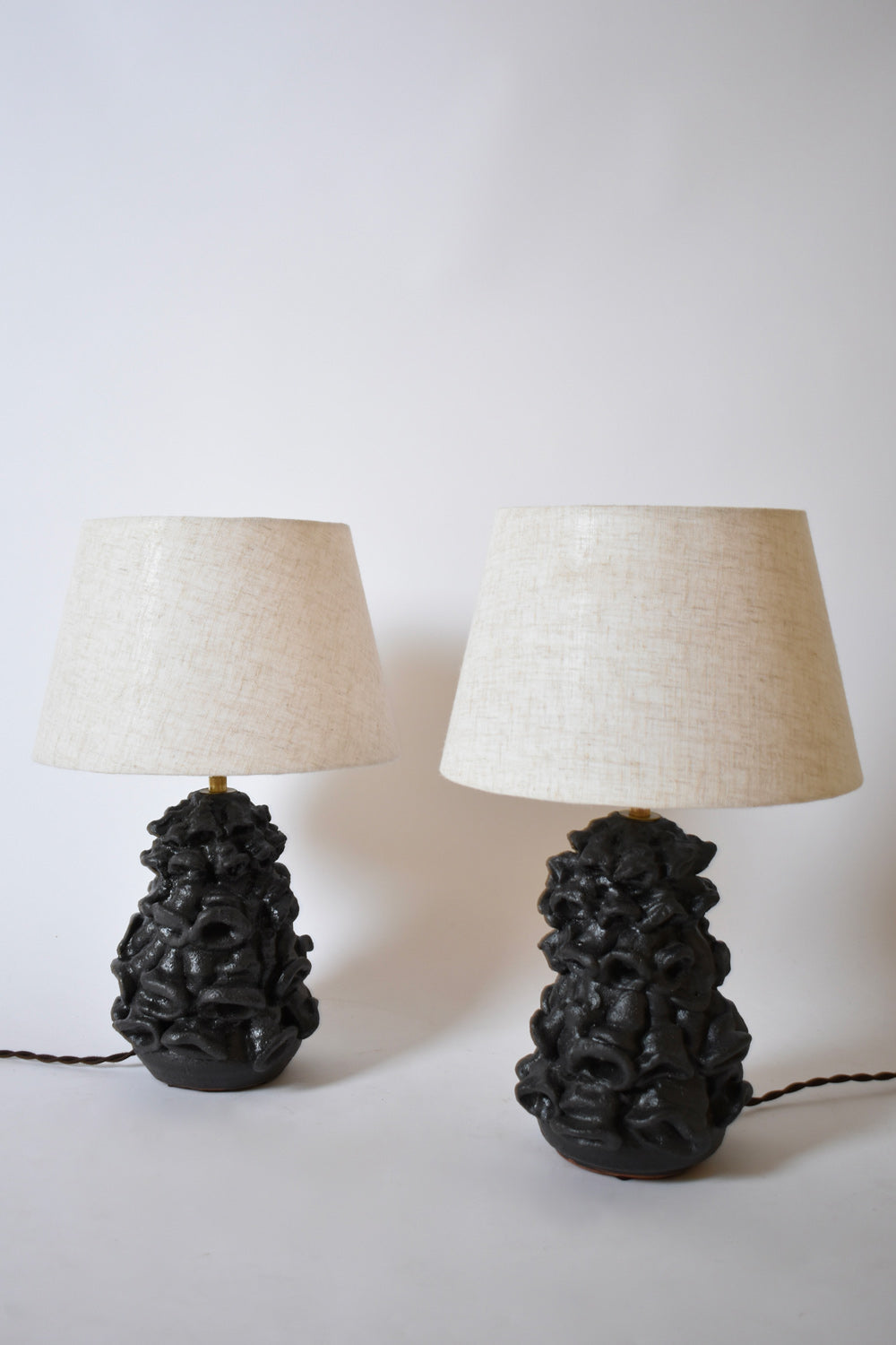 Pair of black mat organic lamps by Helder, 2024.