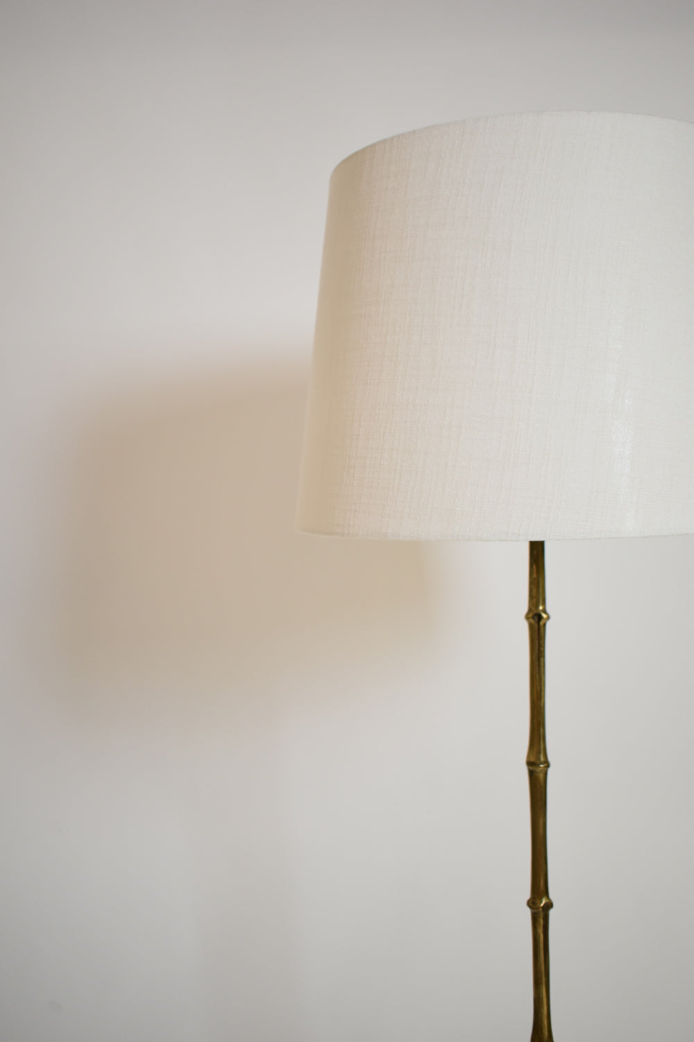 Jansen tripod faux bamboo solid brass floor lamp, 1960s.