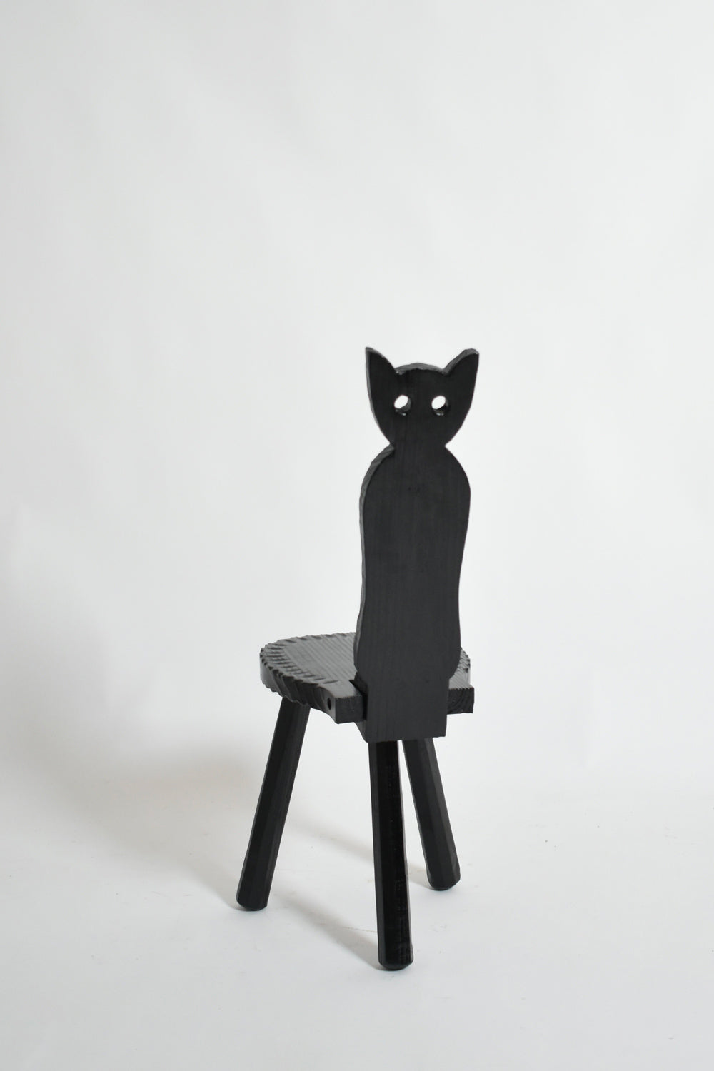 Pair of brutalist ebonised wood owl chairs, 1960s.
