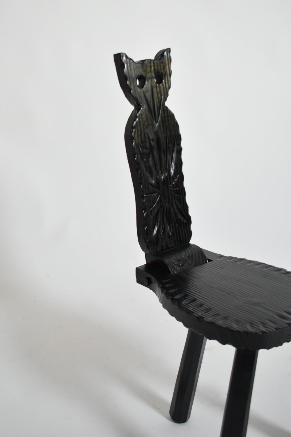 Pair of brutalist ebonised wood owl chairs, 1960s.