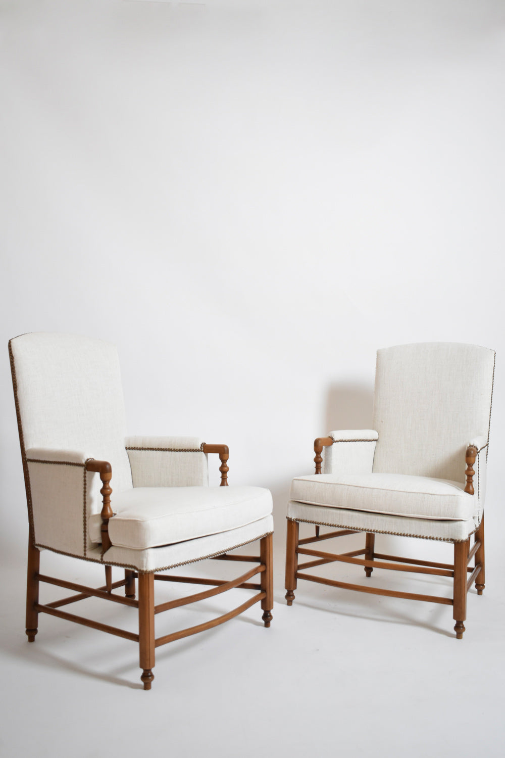 Pair of bergère armchairs, 1950s.