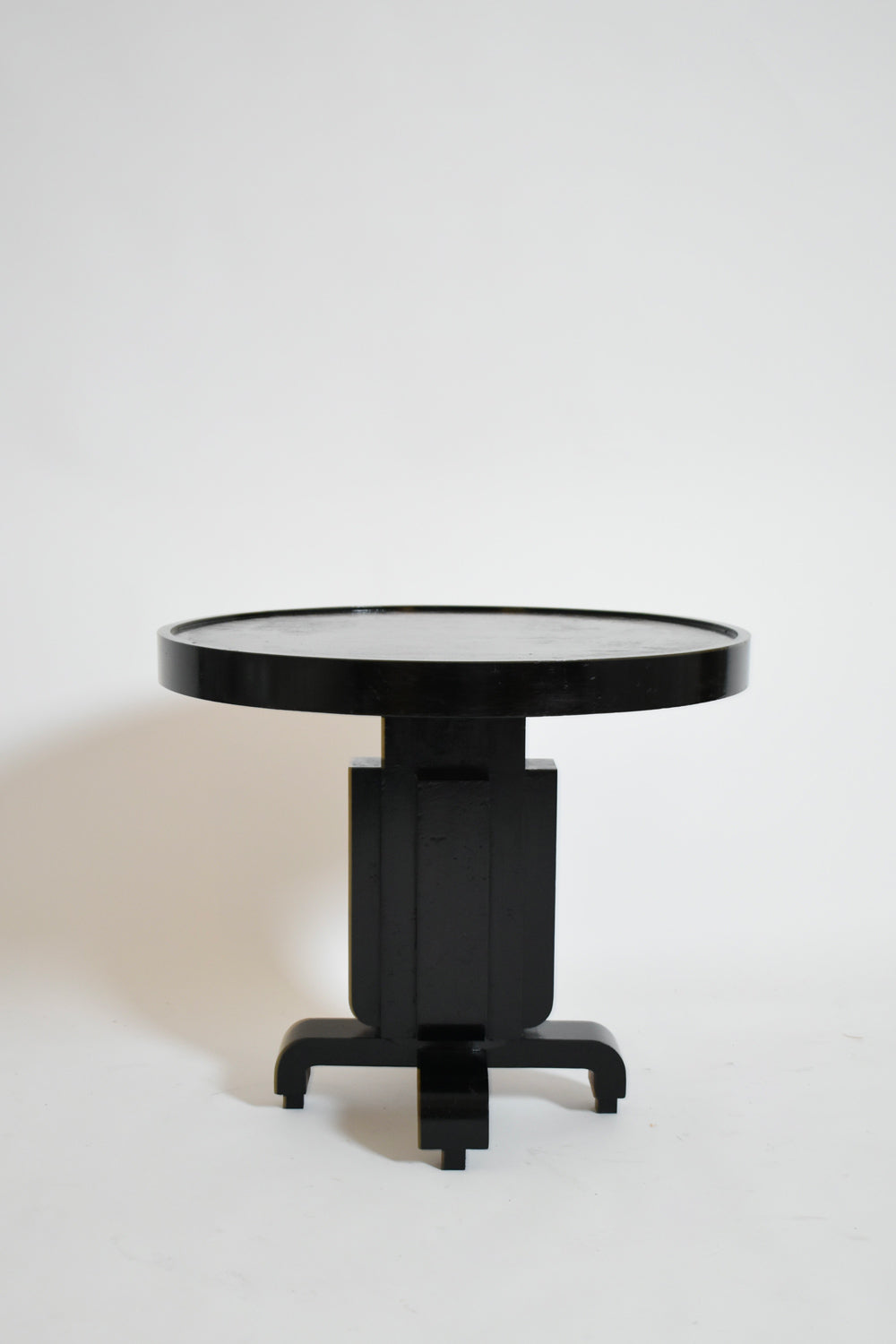 Round ebonised art deco geometric side table, 1930s.