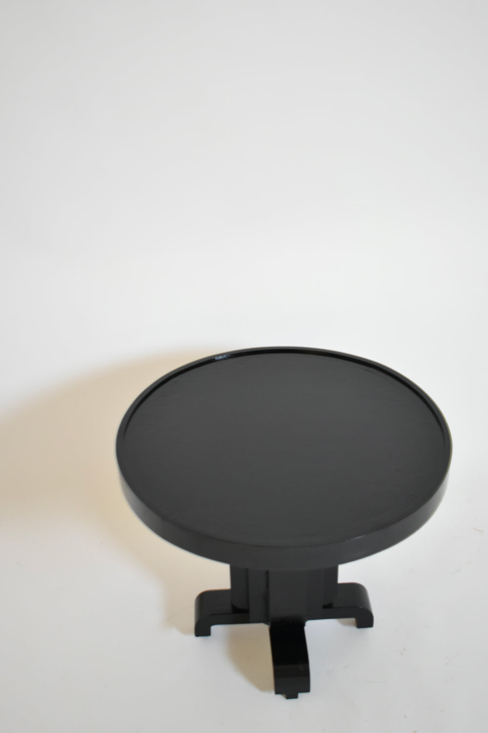 Round ebonised art deco geometric side table, 1930s.