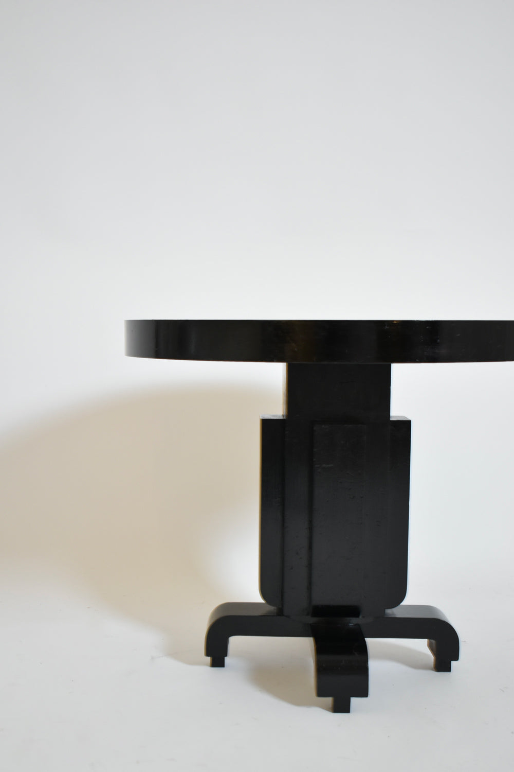 Round ebonised art deco geometric side table, 1930s.