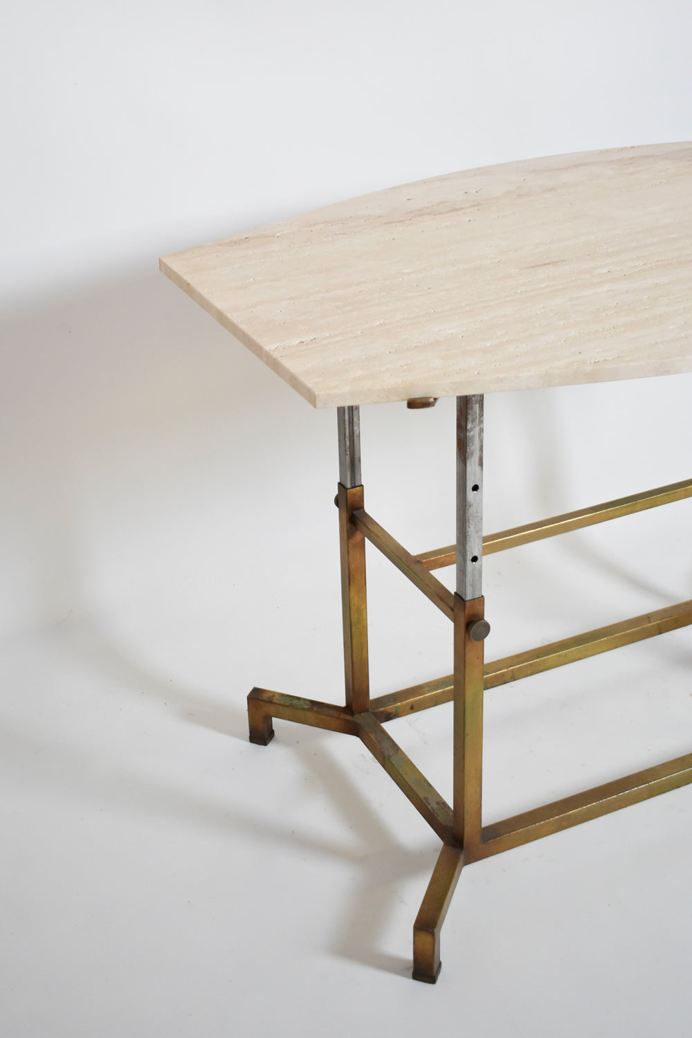 Golden iron and iron and travertine table, 1970s.