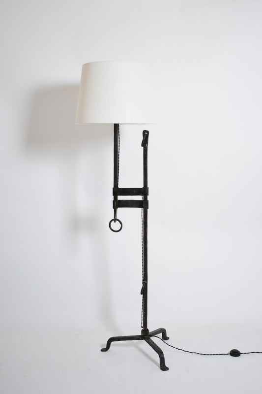 Tripod wrought iron adjustable floor lamp, 1950s.