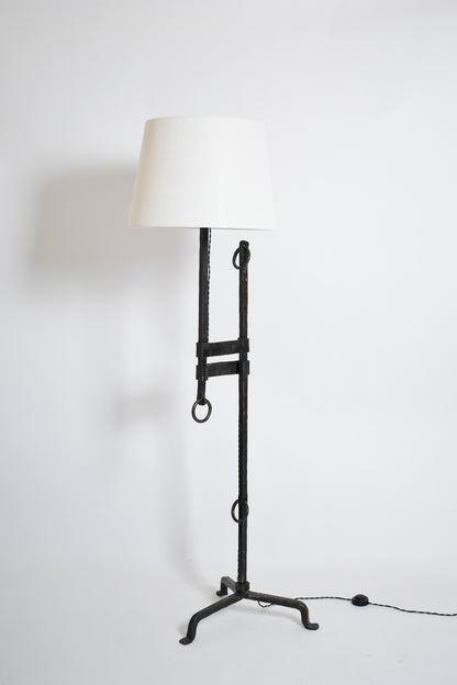 Tripod wrought iron adjustable floor lamp, 1950s.