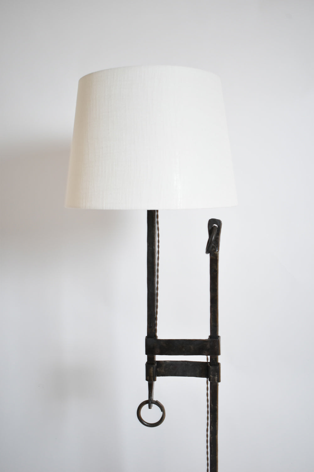 Tripod wrought iron adjustable floor lamp, 1950s.