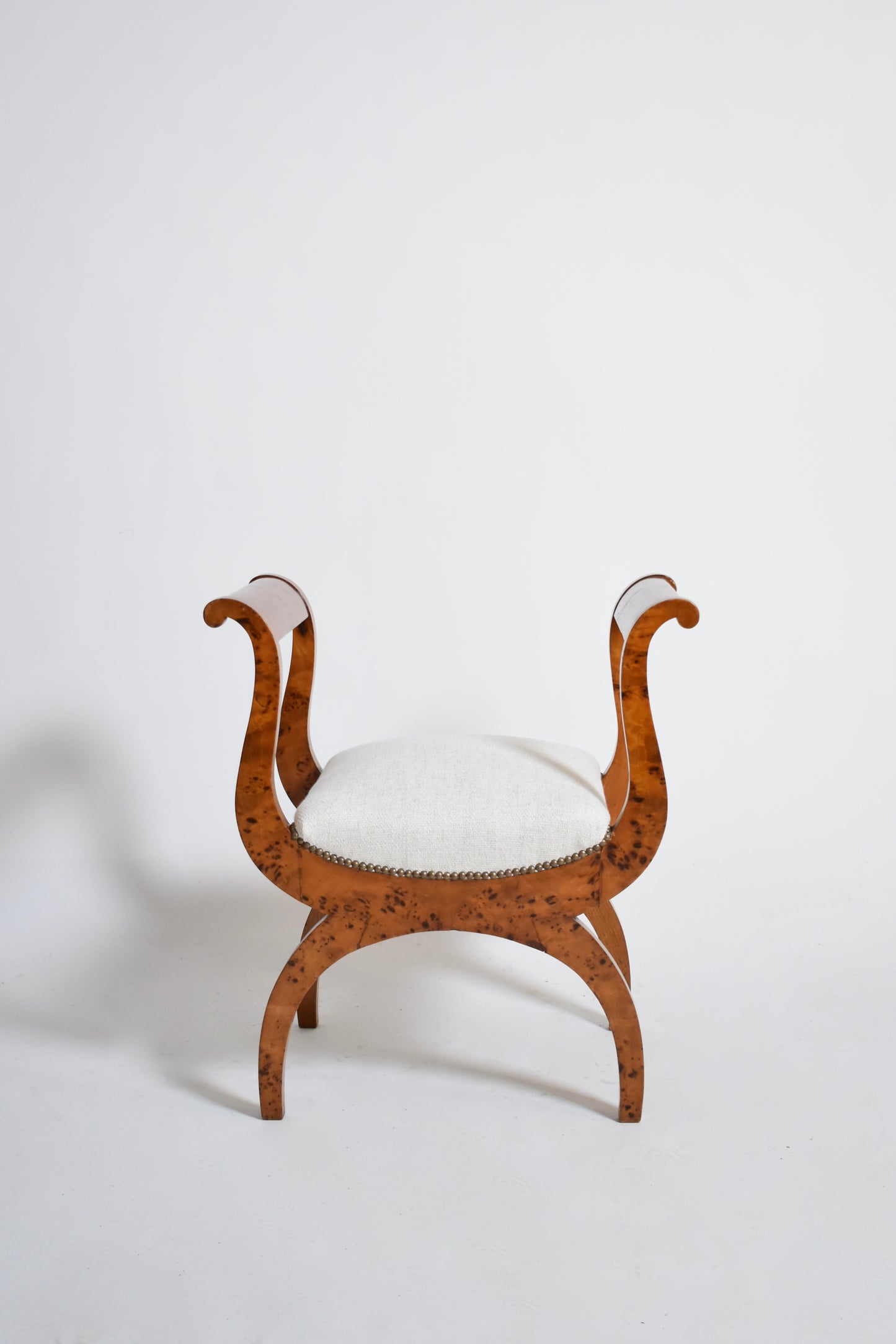 Pair of walnut curule stools, XIXth.