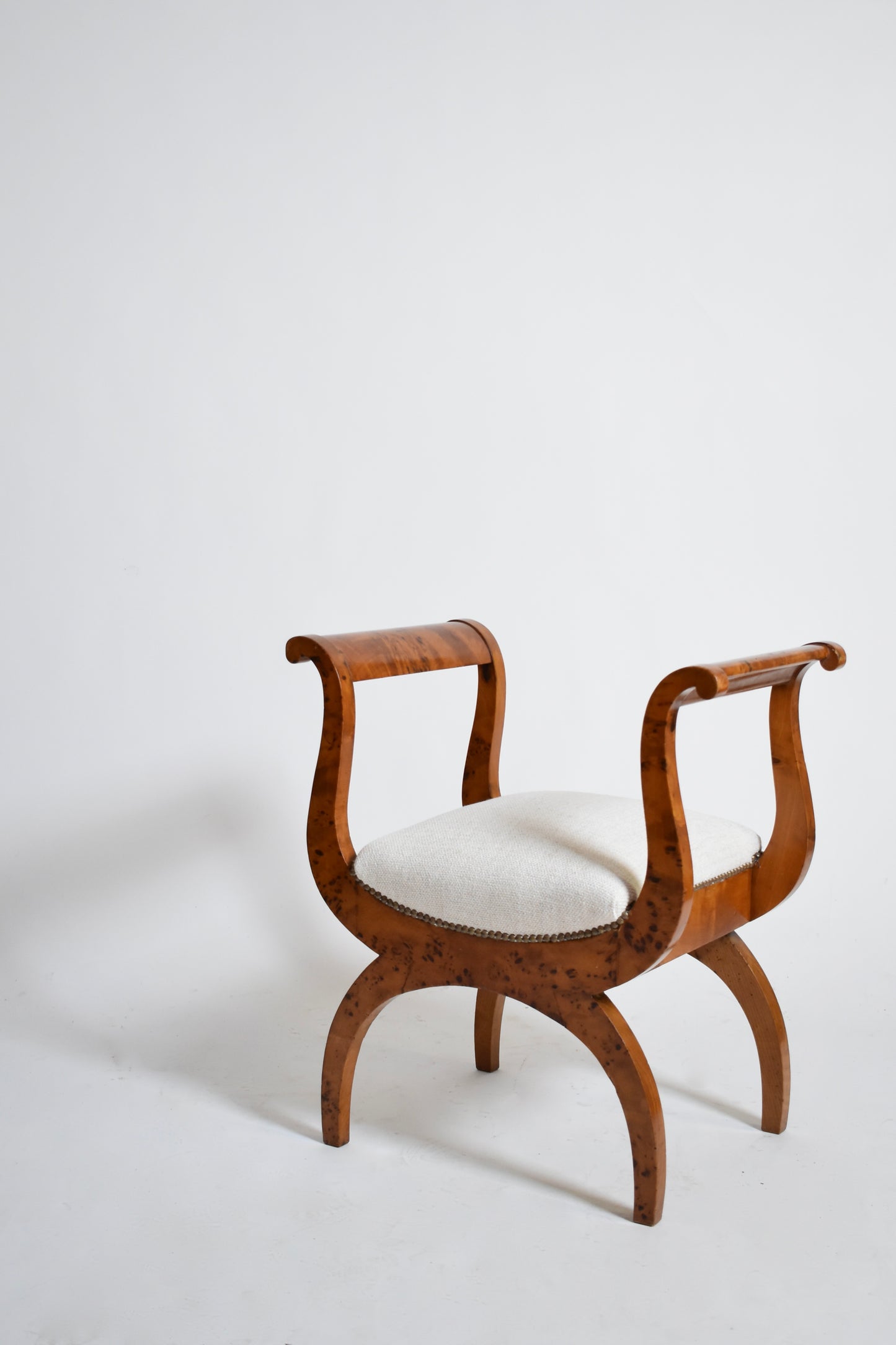 Pair of walnut curule stools, XIXth.
