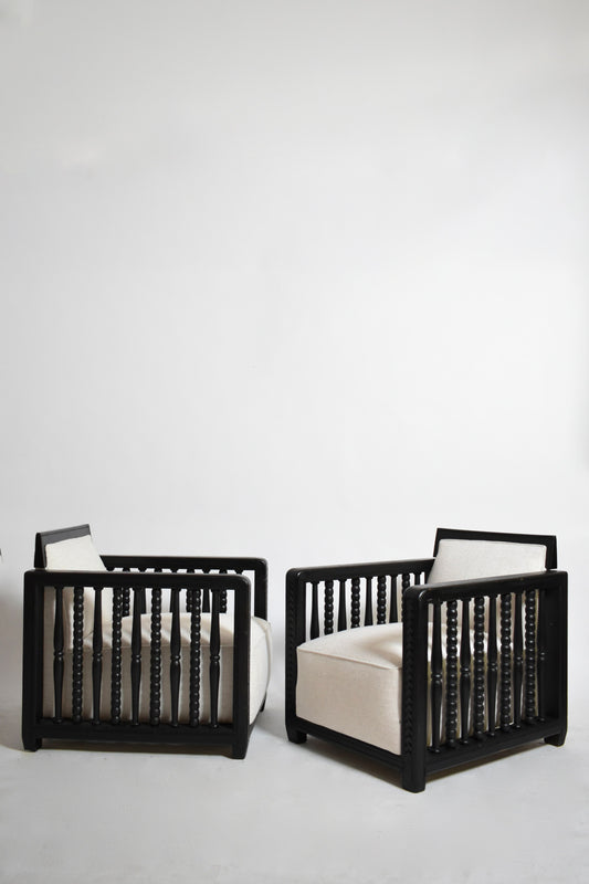 Pair of ebonised wood back top fireside armchairs, 1940s
