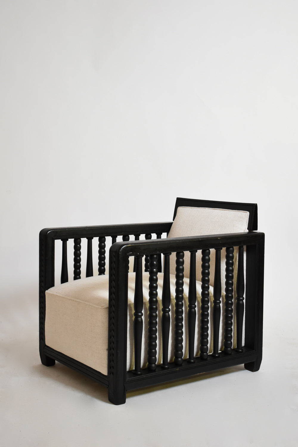 Pair of ebonised wood back top fireside armchairs, 1940s