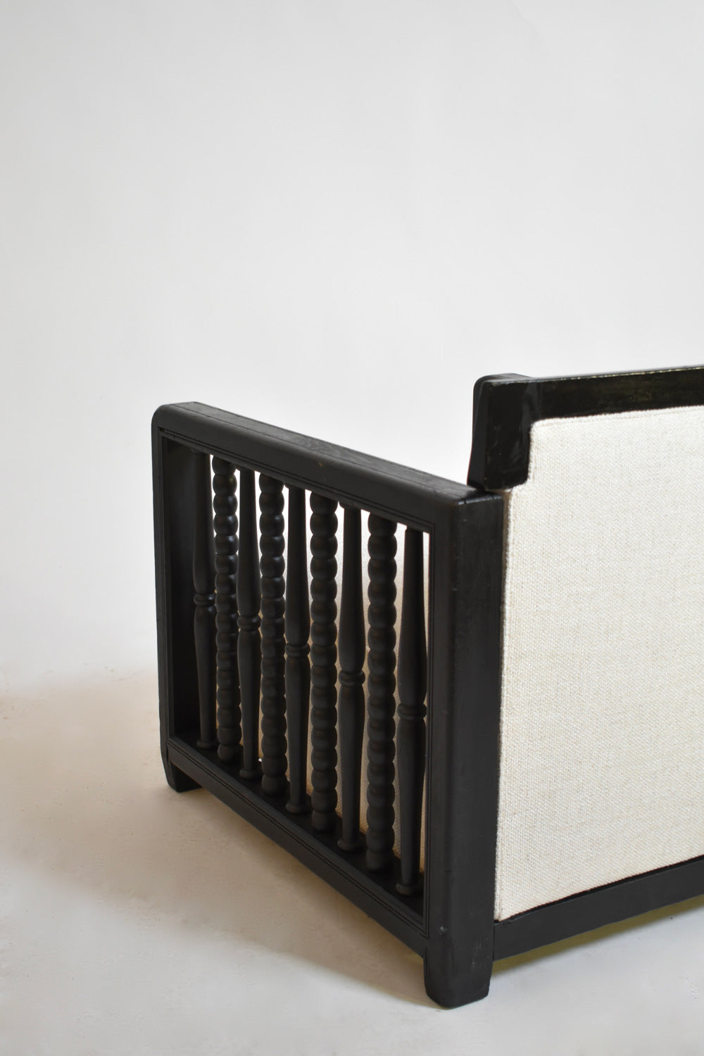 Pair of ebonised wood back top fireside armchairs, 1940s
