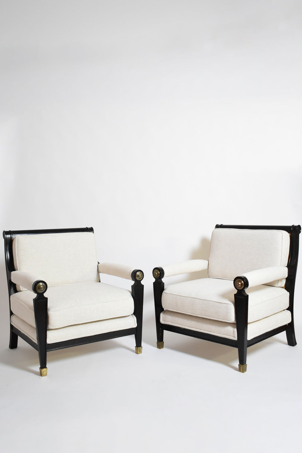 Pair of neoclassical ebonised wood and caning armchairs, 1960s.