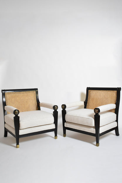Pair of neoclassical ebonised wood and caning armchairs, 1960s.