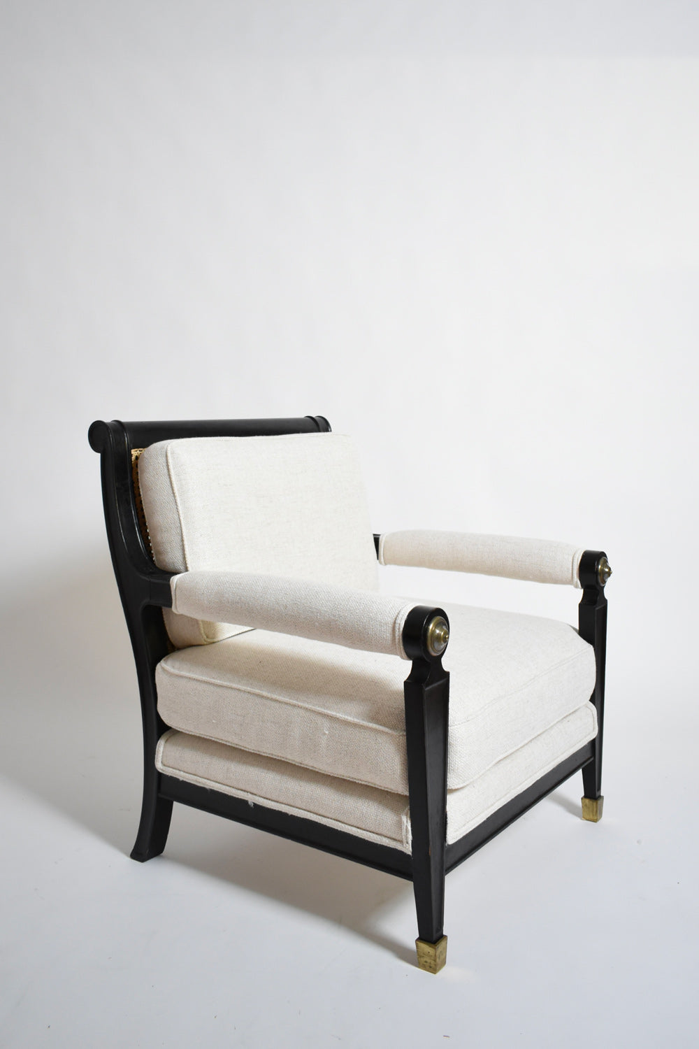 Pair of neoclassical ebonised wood and caning armchairs, 1960s.