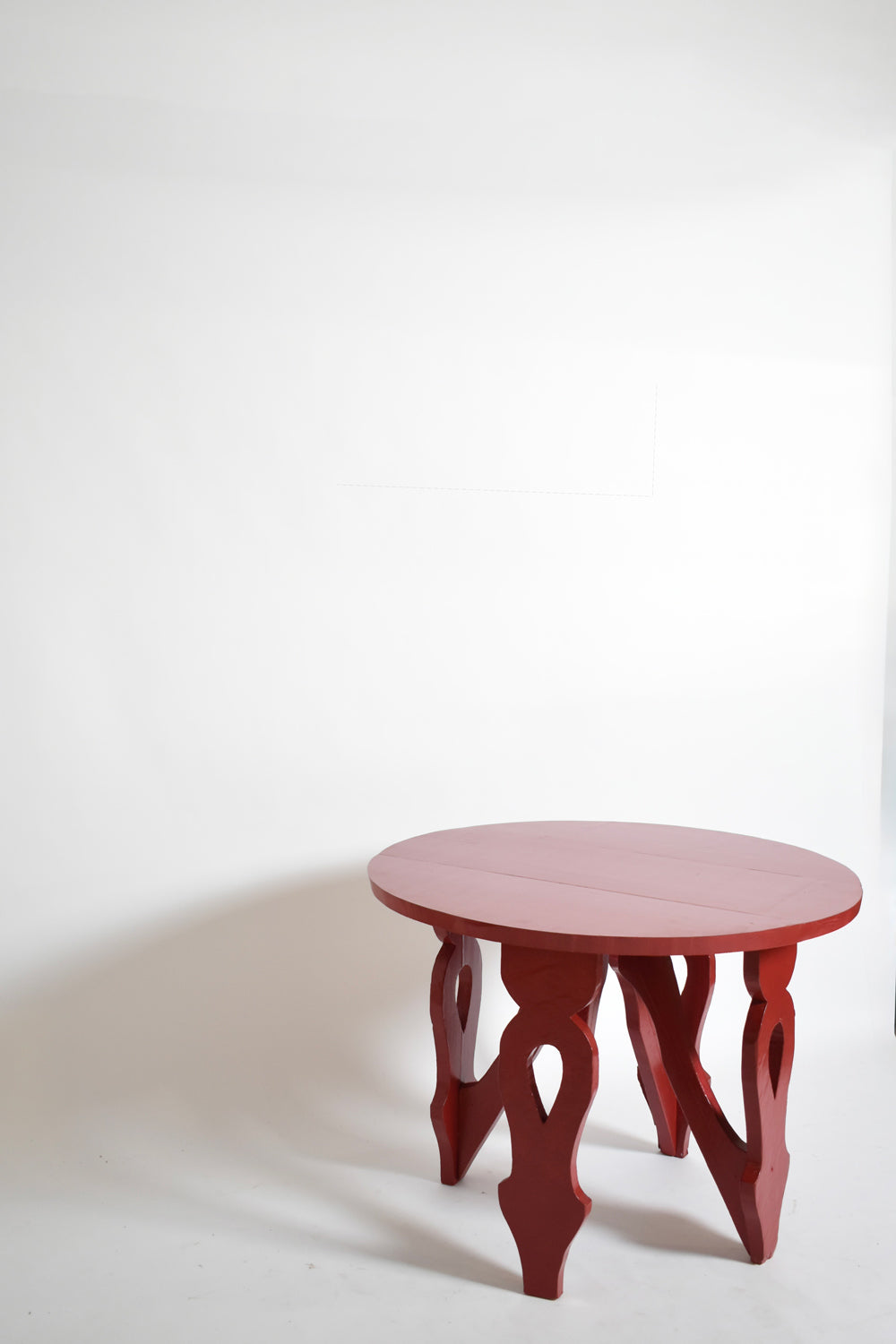 Burgundy red rustic round table, 1920s.