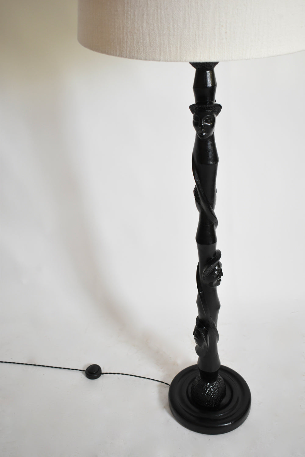Africanist ebonised wood floor lamp, 1970s.