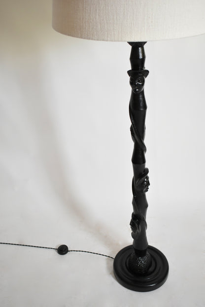 Africanist ebonised wood floor lamp, 1970s.