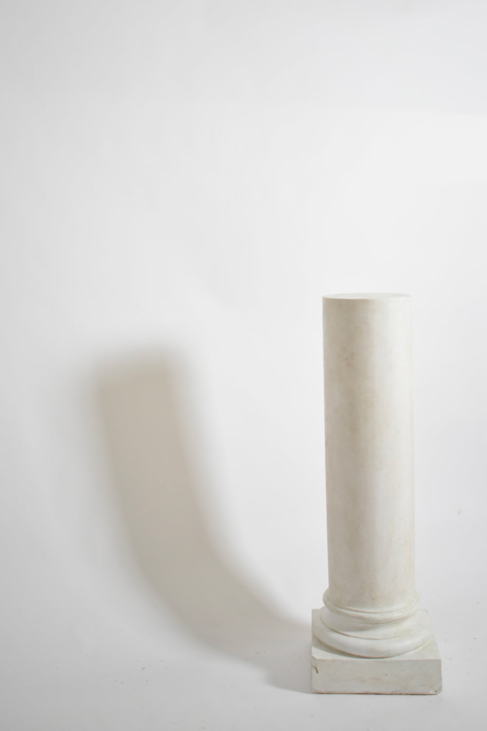 Pair of neoclassical plaster columns, 1930s.