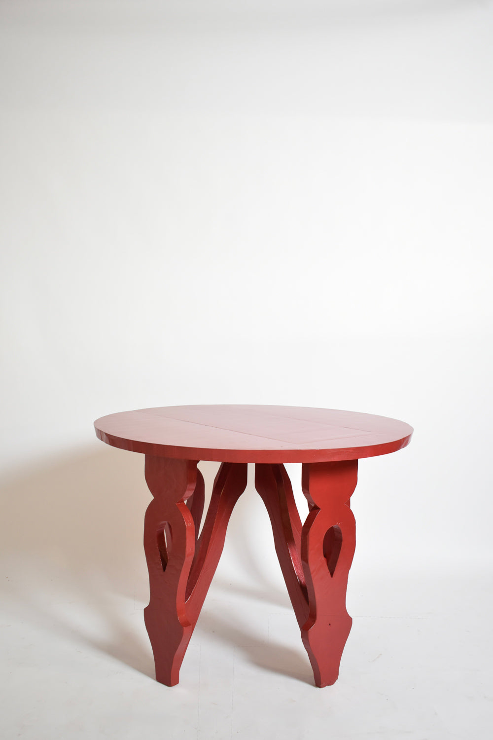Burgundy red rustic round table, 1920s.