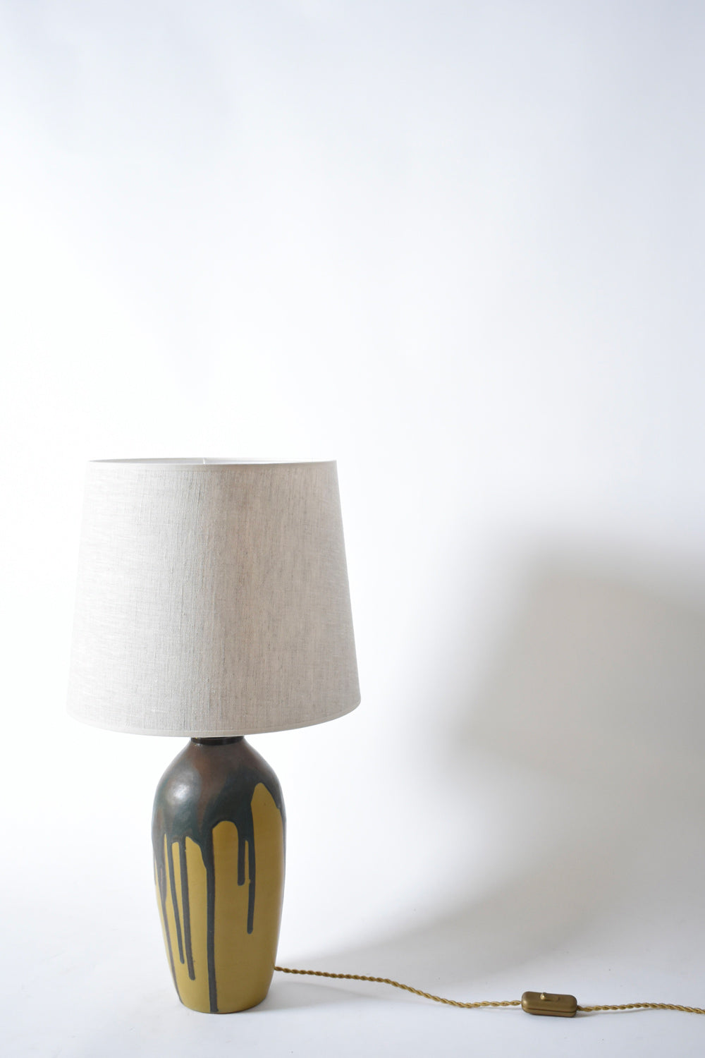 Pair of ochre and brown glaze drips lamps, 1930s.