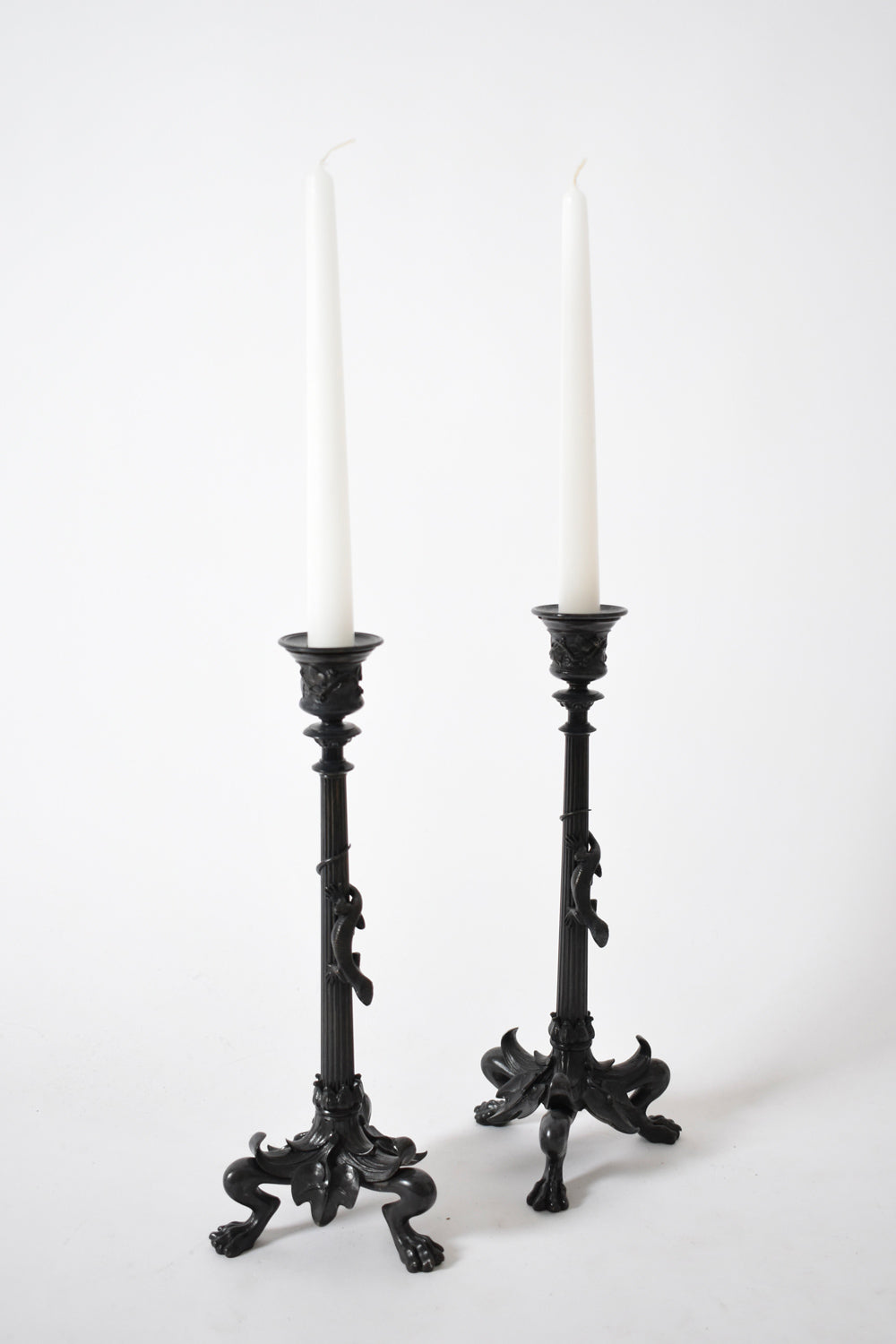 Set of four tripod zoomorphic bronze candleholders, XIXth c.