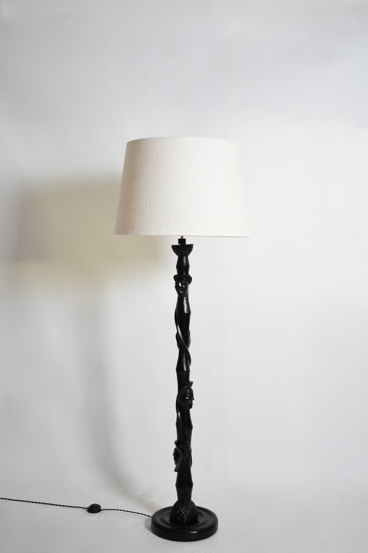 Africanist ebonised wood floor lamp, 1970s.