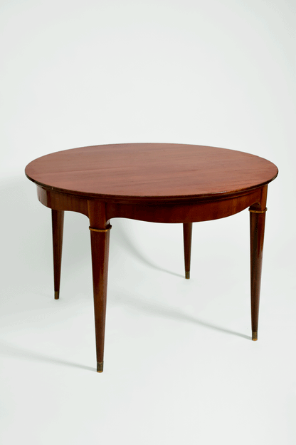 Round wooden dining table. Italy, 1960s.