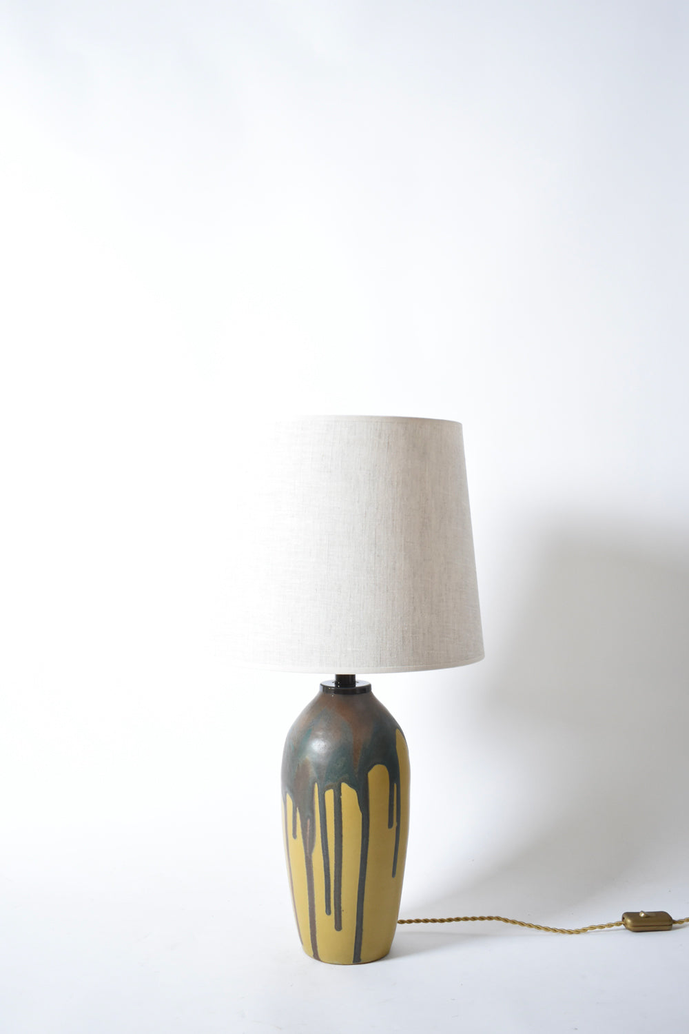 Pair of ochre and brown glaze drips lamps, 1930s.