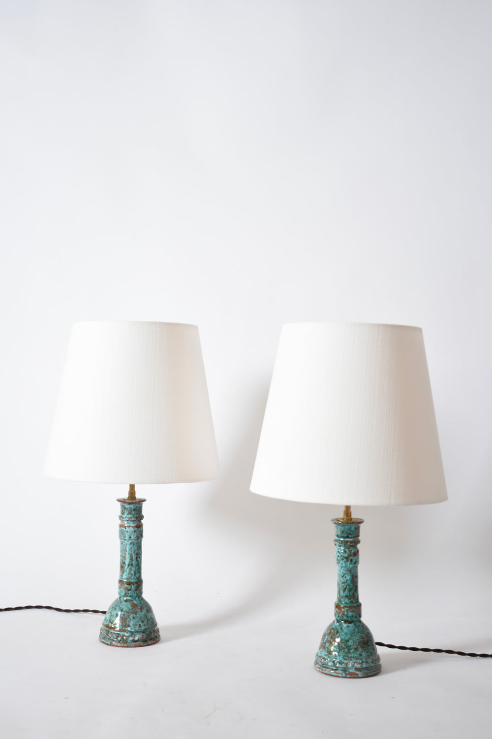 Pair of turquoise and brown lamps.