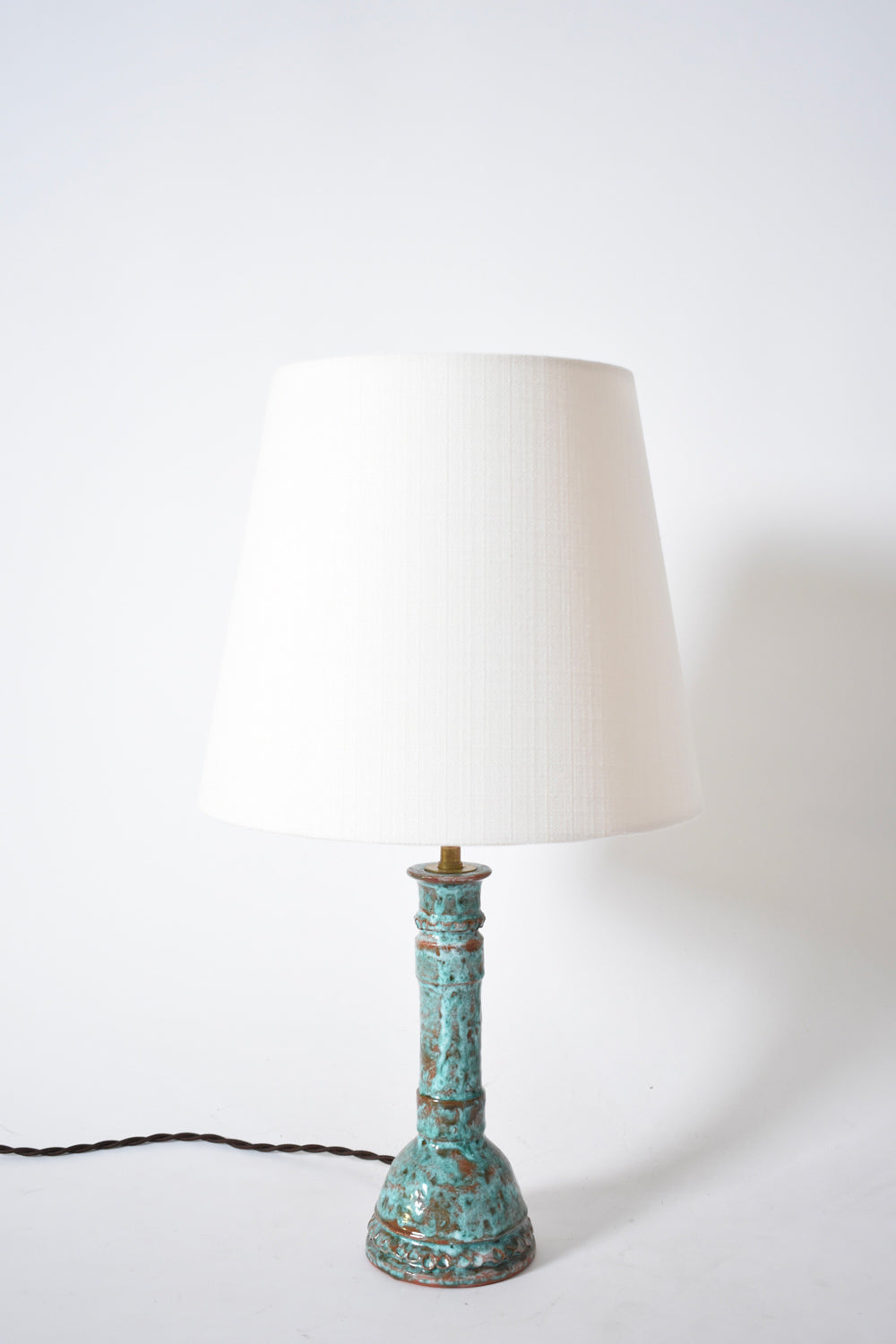 Pair of turquoise and brown lamps.