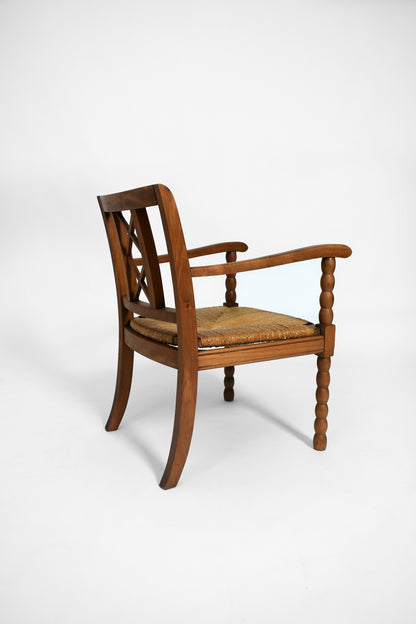 Pair of straw and wood armchairs, 1950s.