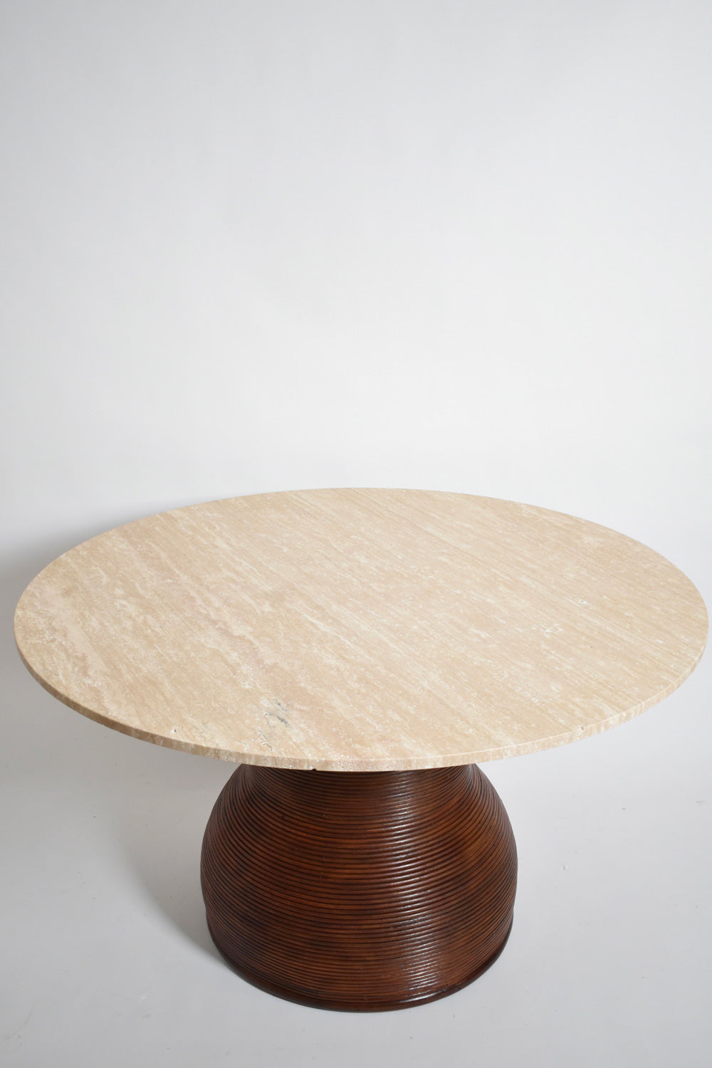 Rattan and travertine round dining table, 1970s.