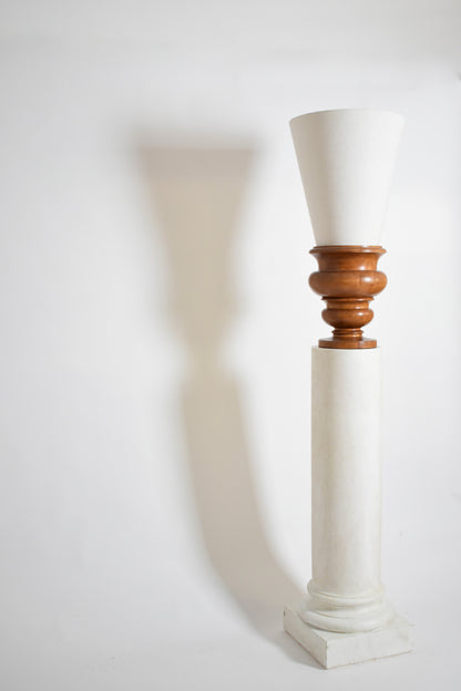 Pair of plaster columns and wooden lamps vases.