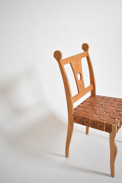 Pair of etruscan oak and leather chairs, 1970s.