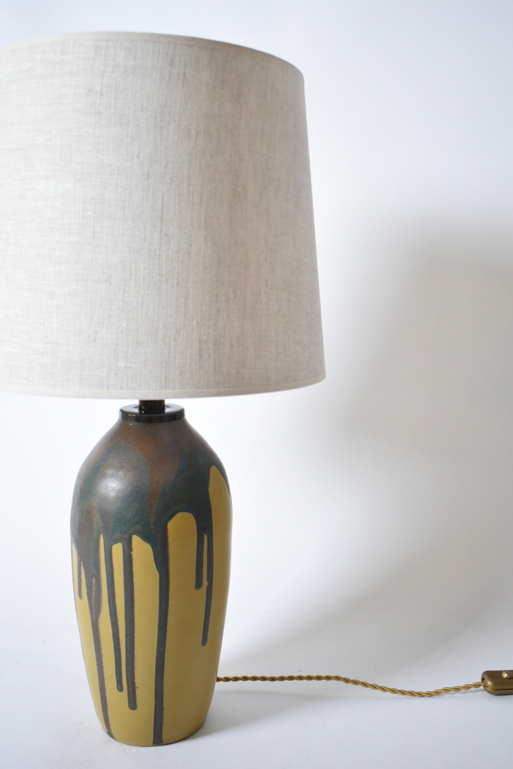 Pair of ochre and brown glaze drips lamps, 1930s.