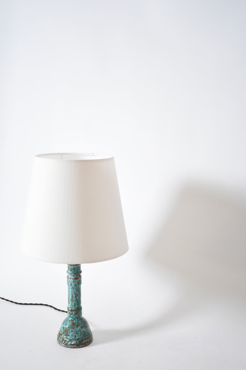 Pair of turquoise and brown lamps.