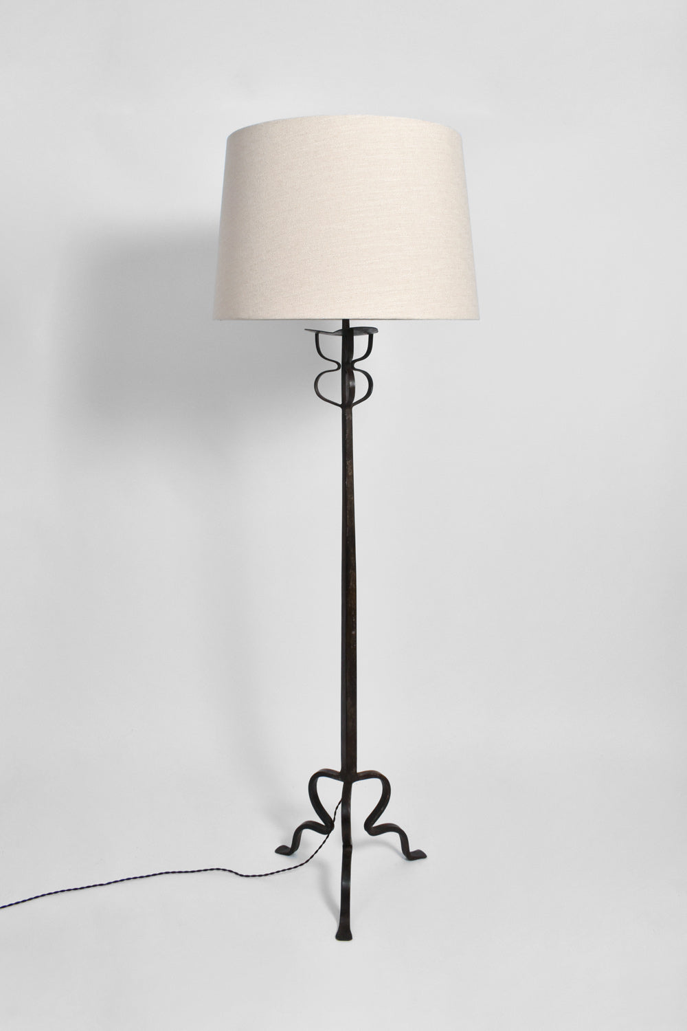 Tripod wrought iron floor lamp, 1960s.