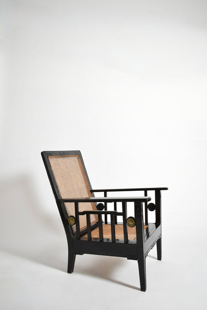 Pair of colonial ebonised wood & caning armchairs, 1920s.