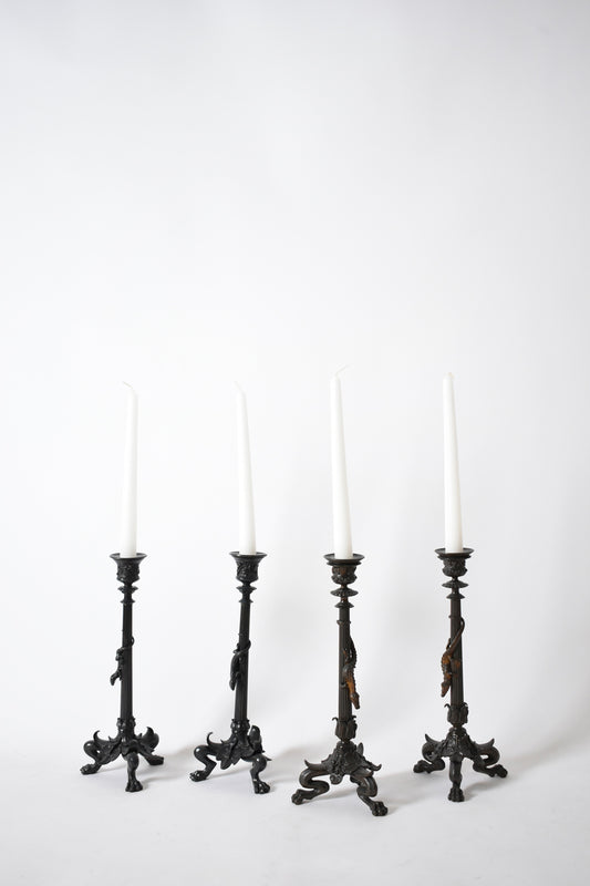 Set of four tripod zoomorphic bronze candleholders, XIXth c.