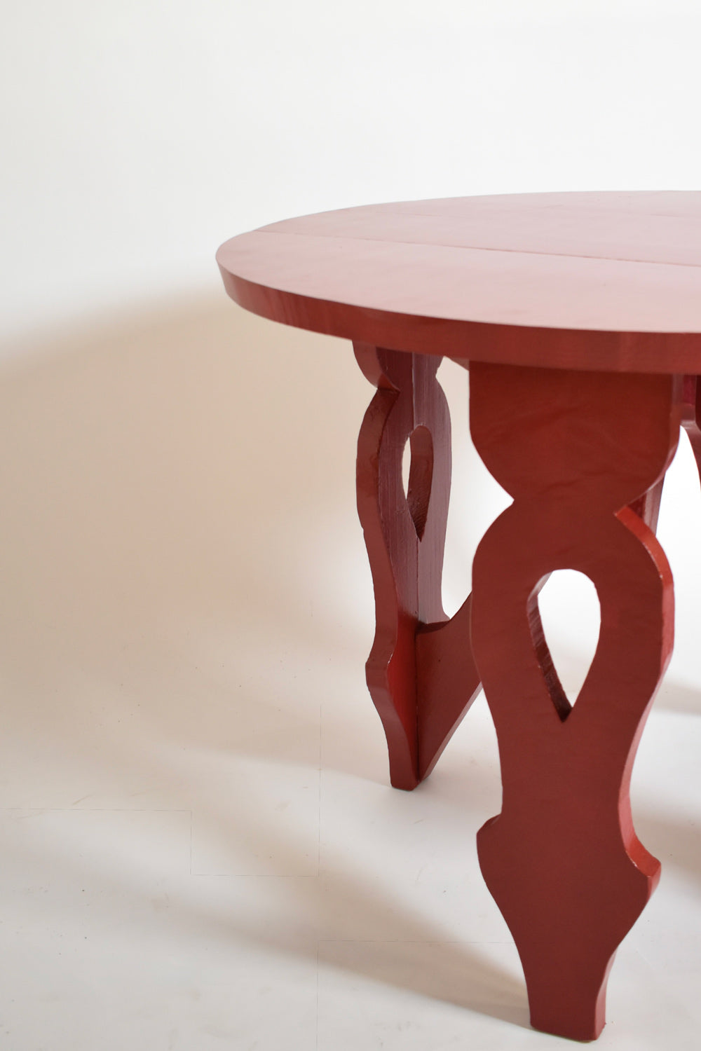 Burgundy red rustic round table, 1920s.
