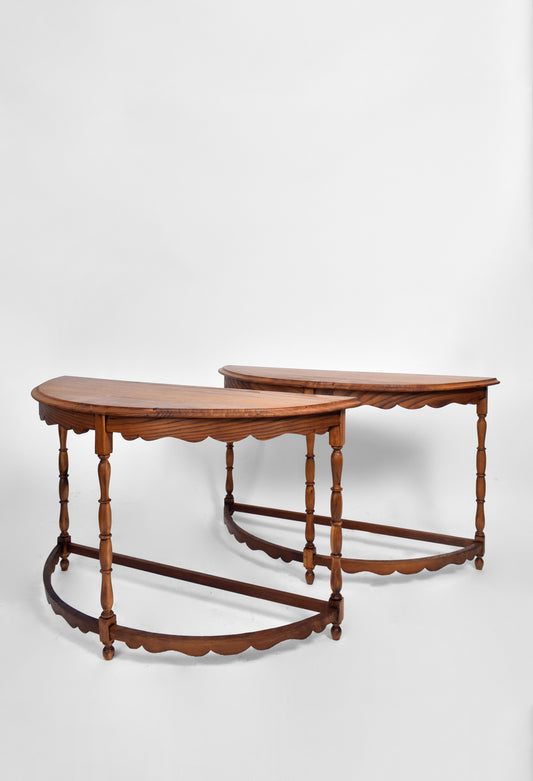 Pair of half moon wooden console tables, 1950s.