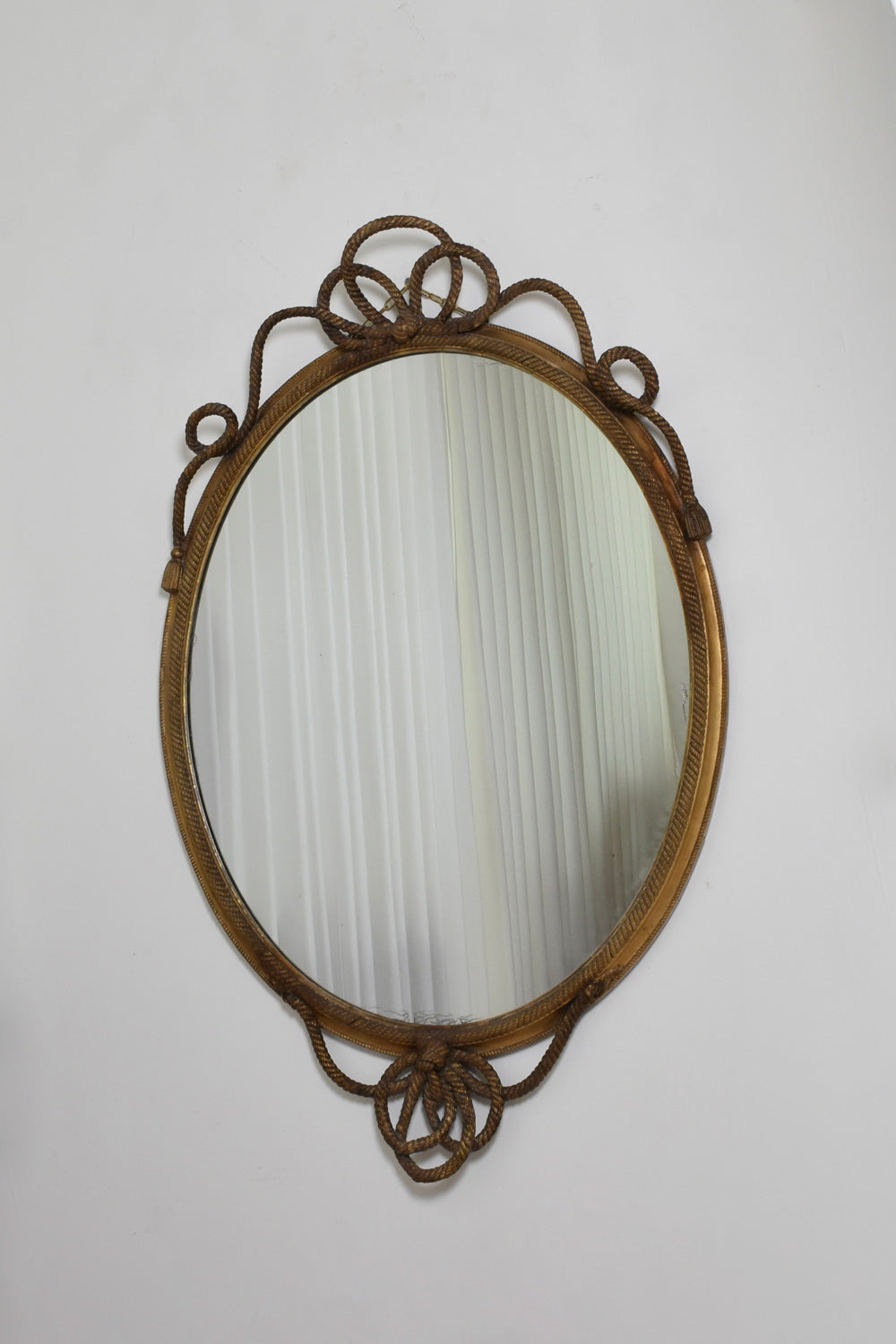 Important oval trimmings and pompoms mirror, XIXth c.