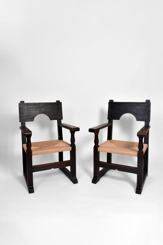 Pair of ebonised and straw armchairs, 1940s.