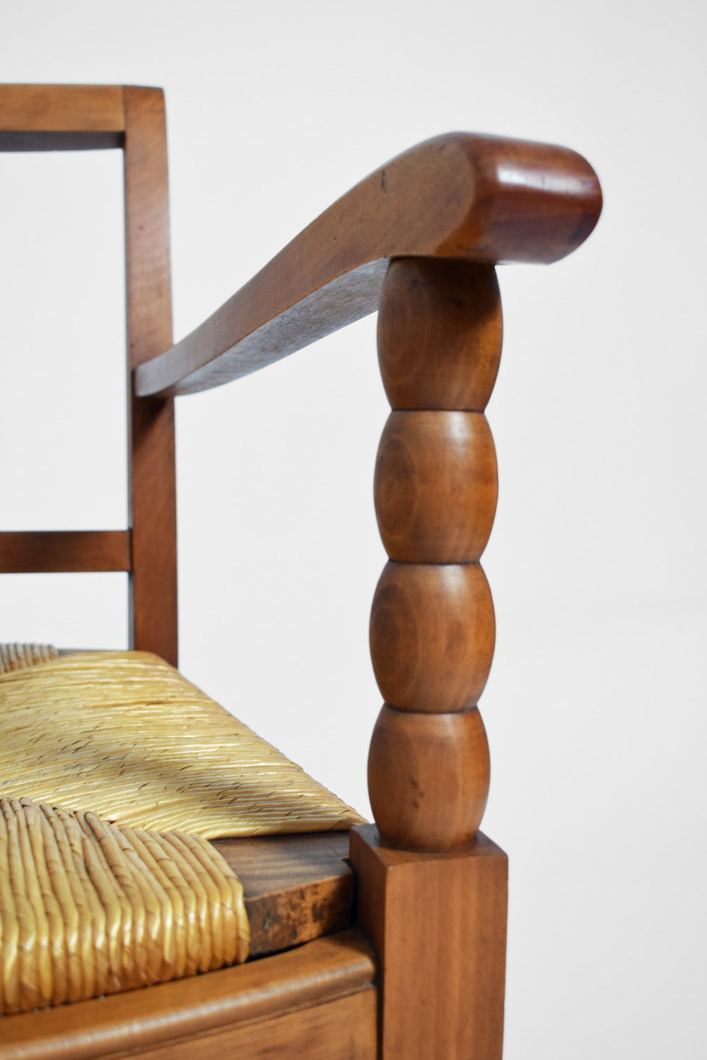 Pair of straw and wood armchairs, 1950s.