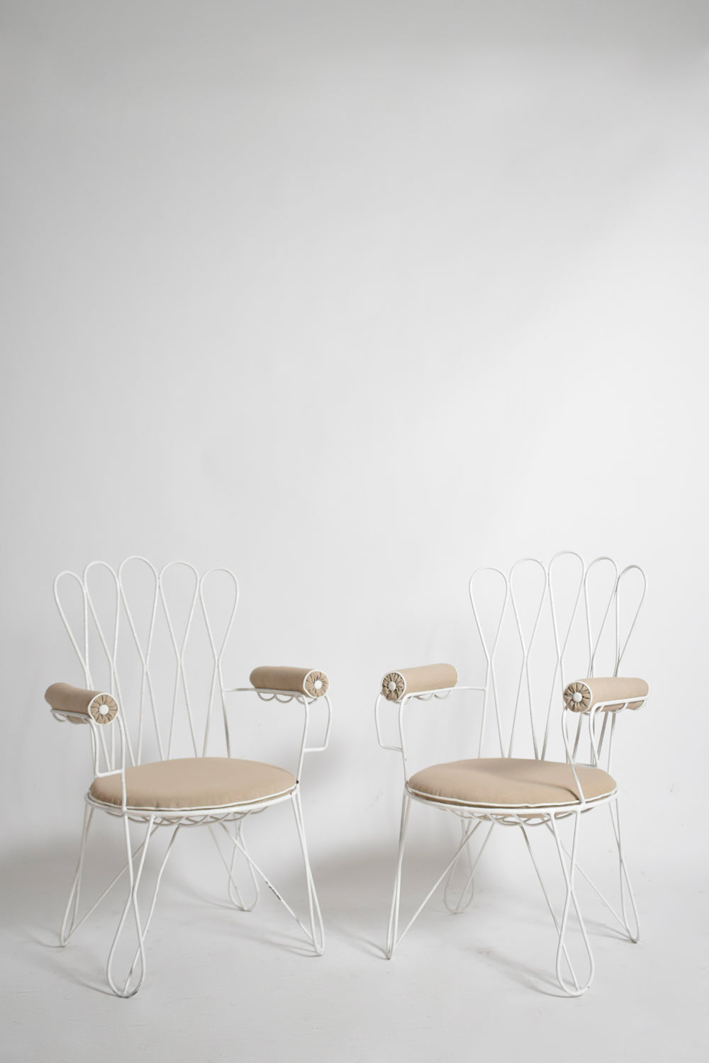 Pair of garden white wrought iron chairs, 1960s.