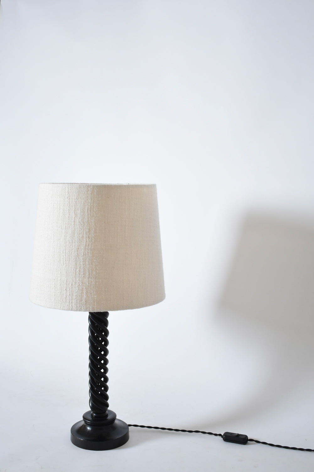 Turned ebonised wooden lamp, 1960s.