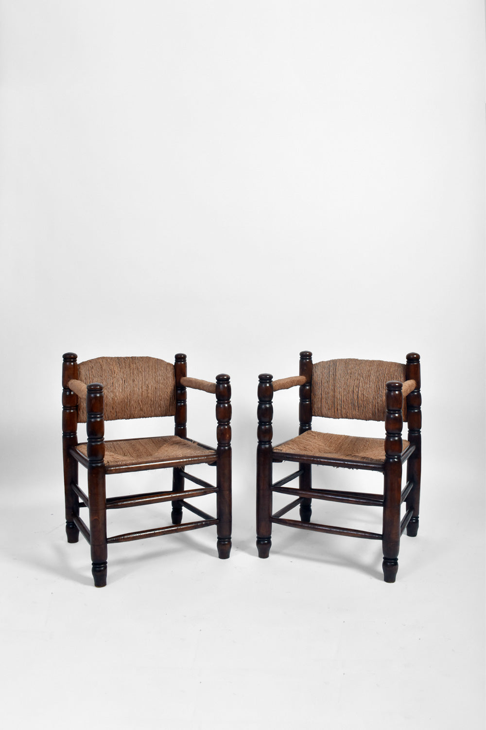 Pair of turned wood and straw  armchairs, 1950s.